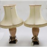 A pair of continental table lamps, each with pink floral body, and cream shade.