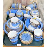 A Ming pattern part tea and dinner service, with serving plates, teacups, saucers, baskets, bowls, e