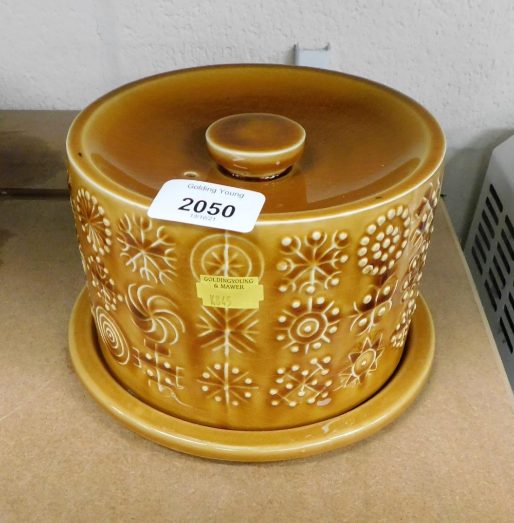 A Portmeirion Totem cheese dish and cover, in mottled brown, 12cm high.