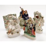 A group of five reproduction Staffordshire style flat back figures, to include male and female clock
