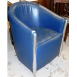 A faux leather tub chair, with chrome supports.