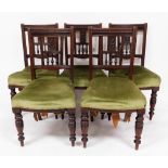 A set of five late 19thC walnut dining chairs, with green draylon seats, 90cm high, 48cm wide. (AF)
