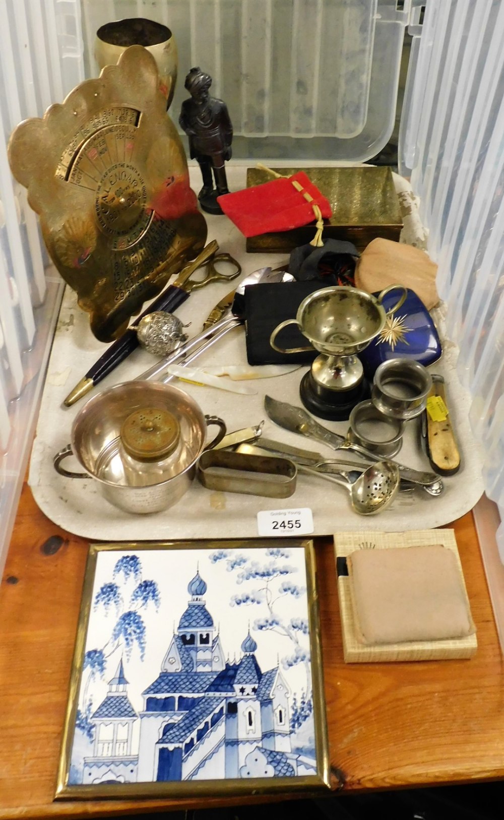 A group of brassware and trinkets, to include an Eastern brass calendar, silver plated trophy cup on