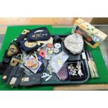 A group of costume jewellery and effects, cap badges, perfumes, etc. (1 tray)