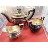An EPNS three piece tea service, comprising teapot, milk jug, and sugar bowl.