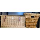 A wicker hamper basket, lacking contents, and a wicker laundry bin.