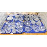 A group of glassware, to include pin dishes, ash trays and candle stands. (4 trays)