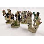 Four 19thC Staffordshire flat back figures, the largest 23cm high.