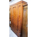 A pitch pine double wardrobe, with single door and drawer, matched, lacking cornice.