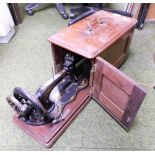 A mahogany cased Singer sewing machine.