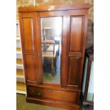 A Victorian walnut single wardrobe with glazed central door above single drawer lacking cornice.