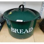 A green enamel circular bread bin with lid.