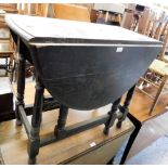 An oak oval drop leaf table.