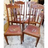 A set of four Morgan & Co of Cardiff oak dining chairs, each with leather inset seat.