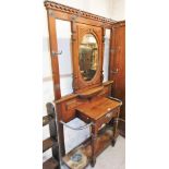 A Victorian hall stand, with various applied hooks and central oval mirror plate, on neoclassical de