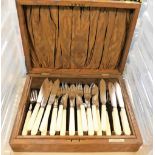 A bone handled cased set of twelve fish knives and forks, each by Alan Clarke and Co, over two tiers