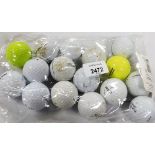 A group of various golf balls.