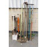 A group of various garden tools, to include rakes, spades, agricultural tools, etc. (a quantity)