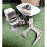 A set of Avery brass weighing scales, various weights and a door latch.