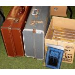 Two leather travel trunks, and a set of children's encyclopaedias.