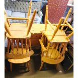 A pine drop leaf kitchen table and four chairs.