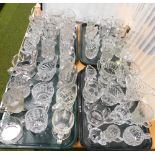 A group of assorted glassware, to include pressed glass milk jugs and others. (4 trays)