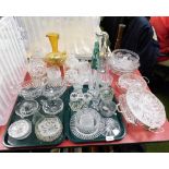 A group of assorted glassware, punch bowls, coloured glass, dressing table sets, two glass lamp shad