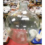 A large glass carboy.