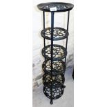 A metal six tier pan stand.