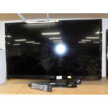 A Seiki 31" flat screen television, with remote control.
