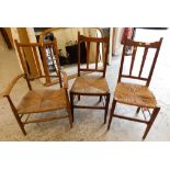 A group of three rush seated chairs.