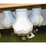 Three various brass and gilt table lamps, with shades.