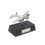 An Elizabeth II silver model of a Lancaster Bomber, on a plinth base, the plaque stating The City of