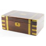 A Victorian rosewood and brass bound writing box, the hinged lid enclosing a green leather slope,