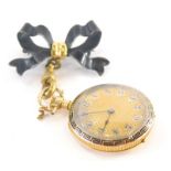 An Edwardian 14ct gold fob watch and chain, the fob watch with gold coloured dial and highlighted