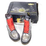 A pair of silver Dr Martens air cushion sole boots, signed by various musicians to include Herbie