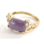 A 9ct gold dress ring, set with central purple rectangular cut stone, with butterfly details set