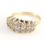 A diamond dress ring, with two rows of round brilliant cut diamonds, each in claw setting, approx