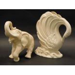 A Delcroft ware ceramic elephant, and a vase titled Leda. (2)