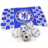 Five Chelsea football club signed footballs, and a flag.