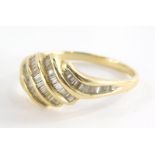 A diamond dress ring, with five layered twist design, each set with baguette cut diamonds, on a