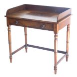 A 19thC mahogany washstand, with raised back above a frieze drawer, on turned tapering legs, 92cm