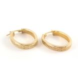 A pair of 9ct gold hoop earrings, each with woven decoration, 3cm drop, 1.8g.