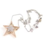 A star pendant and chain, the star pendant set with tiny diamonds with five point rose gold outer