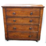 A Victorian figured mahogany chest of four drawers, each with turned wood handles, later castors,
