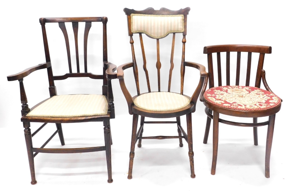 A collection of three Edwardian or early 20thC chairs, each with a padded seat, to include a two