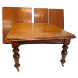 A Victorian mahogany extending dining table, the rectangular top with a moulded edge on turned