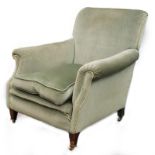 A late 19th/ early 20thC mahogany armchair in the manner of Howard and Sons, with square tapering