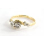 A Victorian 18ct gold and platinum dress ring, the central twist design with two tiny diamonds