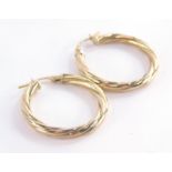 A pair of 9ct gold hoop earrings, each of twist design, 2.5cm high, 1.3g.